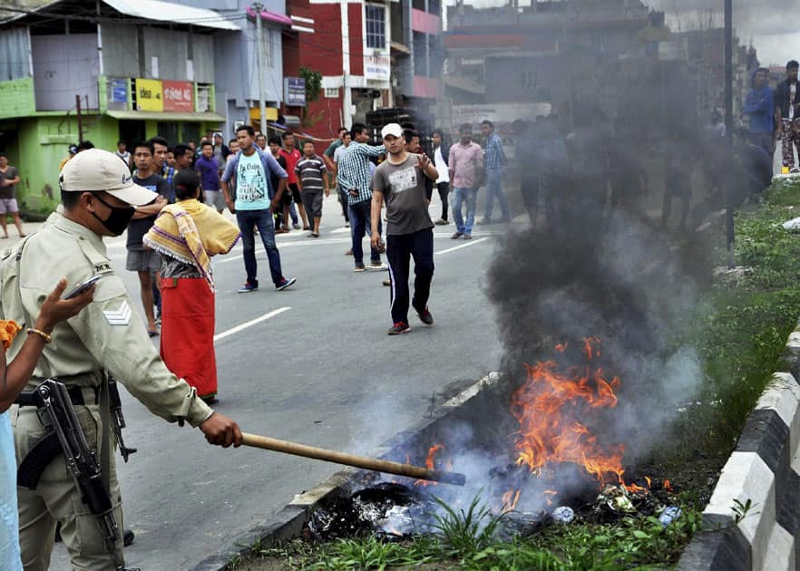 People blocking roads and burning tyres after The Joint Committee on Inner Line Permit System (JCILPS)called a 38-hour statewide bandh, in Imphal.