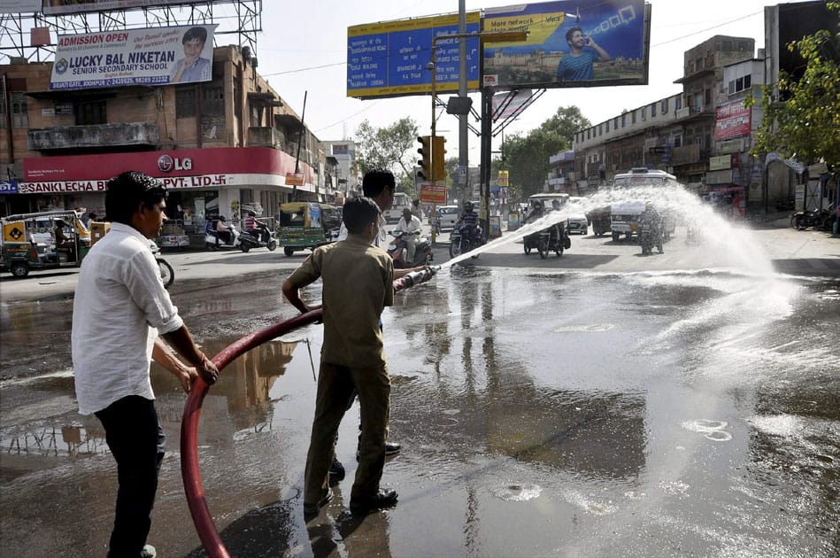 Water tenders are being used to cool down roads as temperature rises in Jodhpur, Rajasthan.
