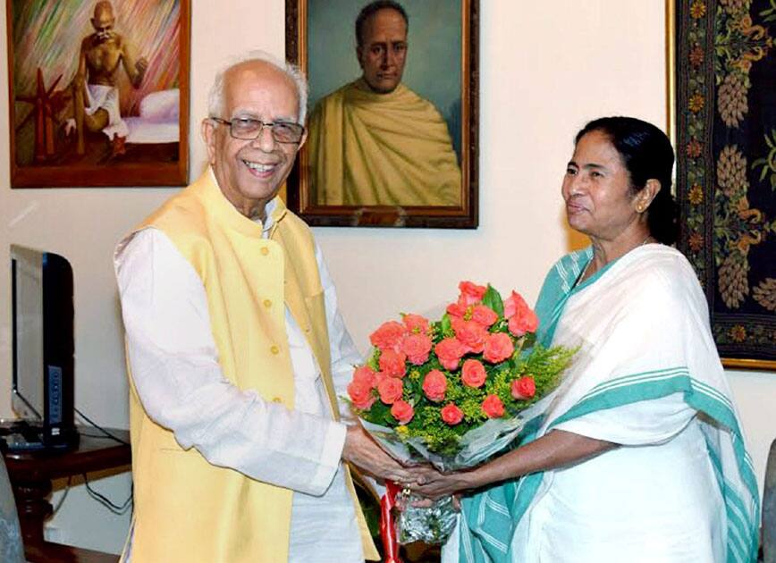 West Bengal Governor Keshari Nath Tripathy greeting TMC Supremo Mamata Banerjee during their meeting at Governors House in Kolkata.
