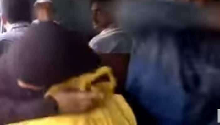 Watch: Atrocious! Muslim man punches hard on burkha-clad wife&#039;s back in train, but no one comes to her rescue