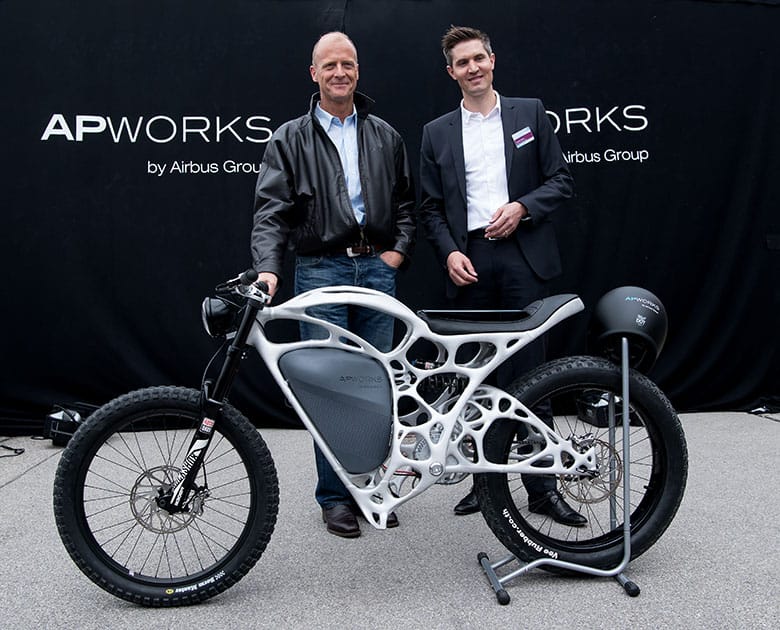 The CEO of Airbus, Tom Enders, left, and the head of APWorks, Joachim Zettler, present the first 3D printed electric motorcycle in Ottobrunn, Germany.