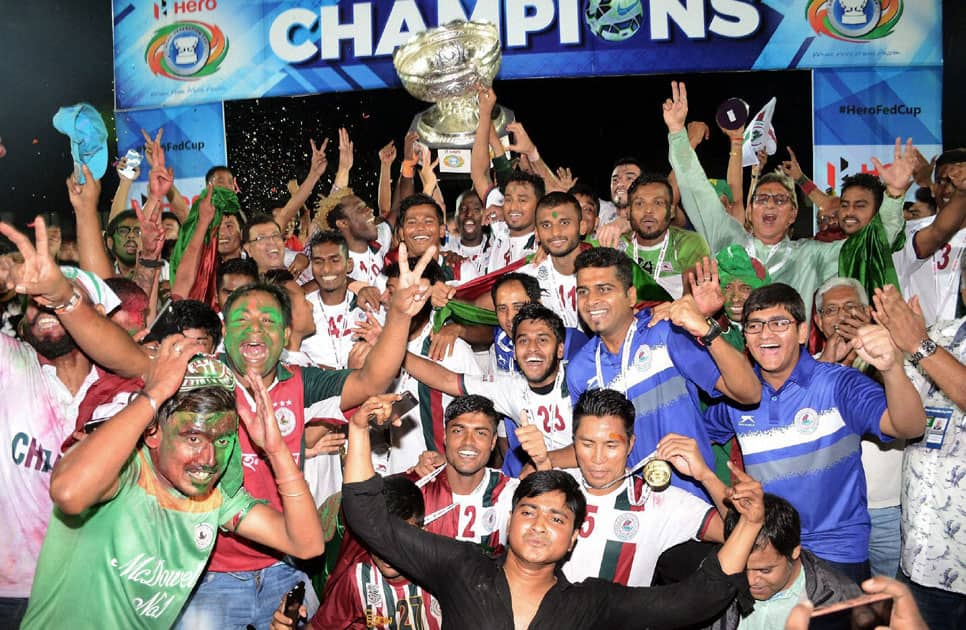 Players and officials of Mohan Bagan with winning trophy of Federation Cup 2016 after defeating Aizwal Football Club at Indira Gandhi Athletics Stadium, Sarusajai in Guwahati.