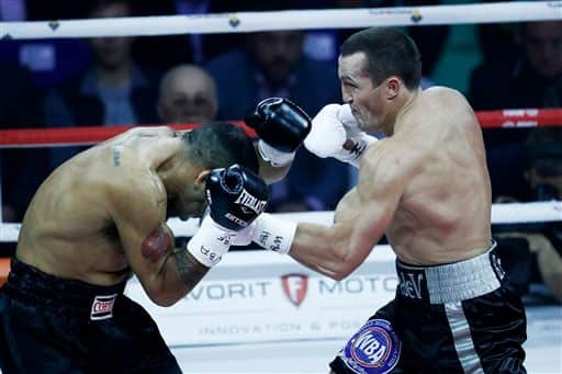 WBA cruiserweight world champion Denis Lebedev, right, punches IBF cruiserweight champion Victor Emilio Ramirez during their IBF and WBA Super World cruiserweight title fight in Moscow, Russia.