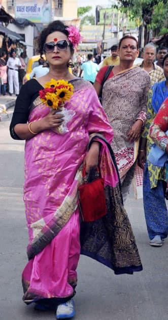 Indias first transgender college principal Manabi Bandopadhay arrives to greets West Bengal Chief Minister Mamata Banerjee for her partys thumping victory,at Kalighat residence in Kolkata.