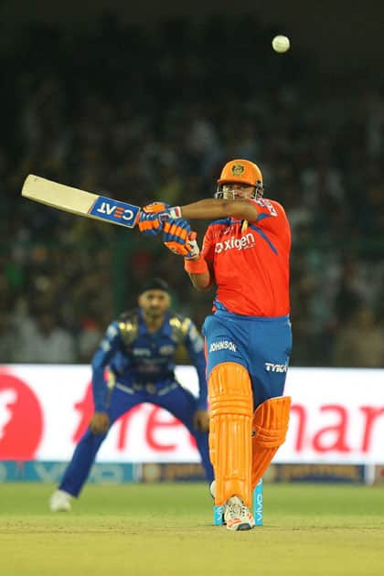 Suresh Raina captain of Gujrat Lions plays a shot during an IPL match against Mumbai Indians at Green Park in Kanpur.