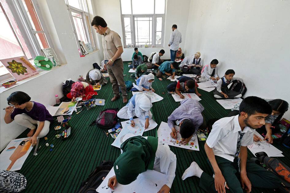 Students participate in a painting competition under the theme of Drug Addiction is an Invitation to Death and Destruction organised by Excise Department Jammu and Kashmir, in Srinagar.
