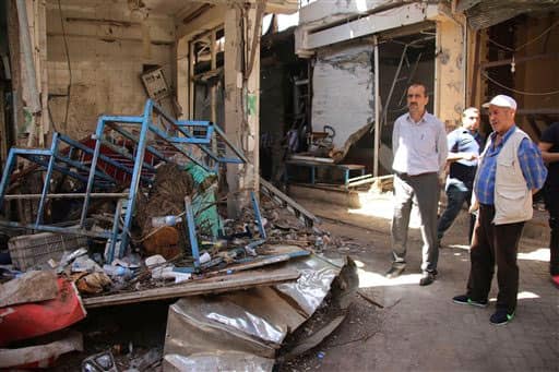 Residents inspect damage in parts of the historic district of the mainly Kurdish city of Diyarbakir, southeastern Turkey.