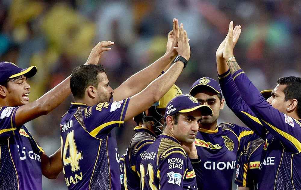 KKR bowler Sunil Naraine jubiliate with his teammates after dismissed SRH batsman David Warner during an IPL match against SRH in Kolkata.