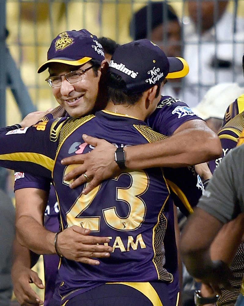 KKR captain Gautam Gambhir being greeted by his team bowling coach Wasim Akram after their win in IPL match against SRH in Kolkata.