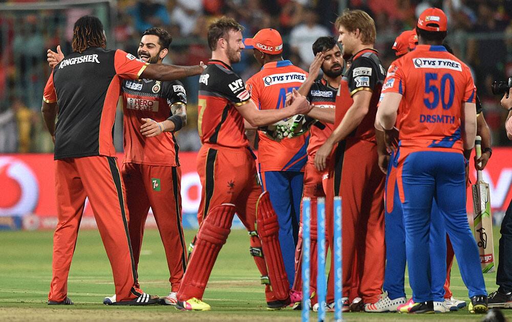 Royal Challengers Bangalores AB De Villiers with team mates celebrate after winning during the 1st qualifier IPL 2016 match against Gujarat Lions at Chinnaswamy Stadium in Bengaluru.