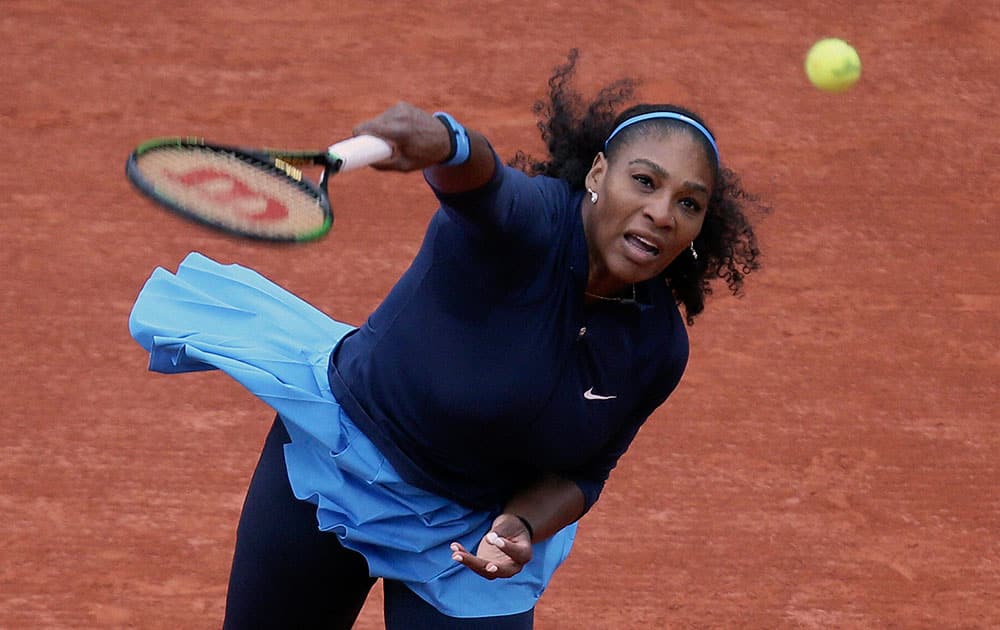 Serena Williams of the U.S. serves the ball to Slovakias Magdalena Rybarikova during their first round of the French Open tennis tournament.