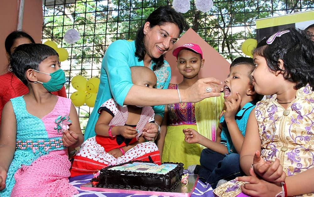 Former Congress MP Priya Dutt interacts with cancer patient kids during the inaugurating of Nargis Dutt Memorial Charitable Trust Hospital in Thane, Mumbai.
