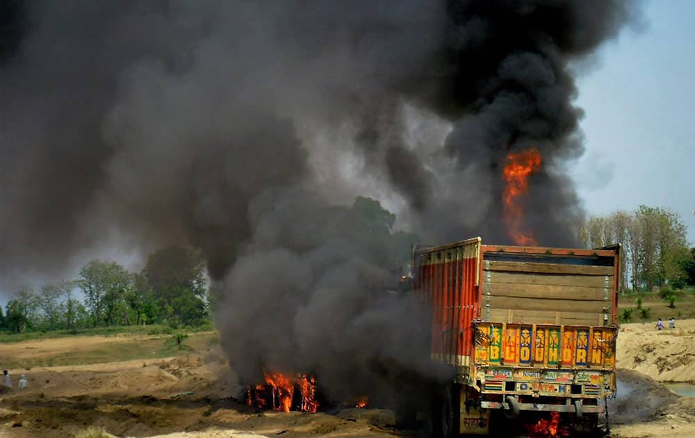 Angry mob set affire trucks after death of two boys in an accident in Gaya district.