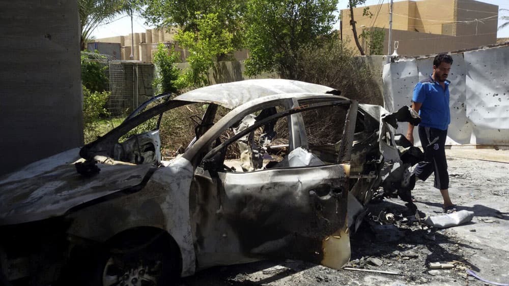 A man inspects the damage at his home after a bombing in Fallujah, 40 miles (65 kilometers) west of Baghdad, Iraq.