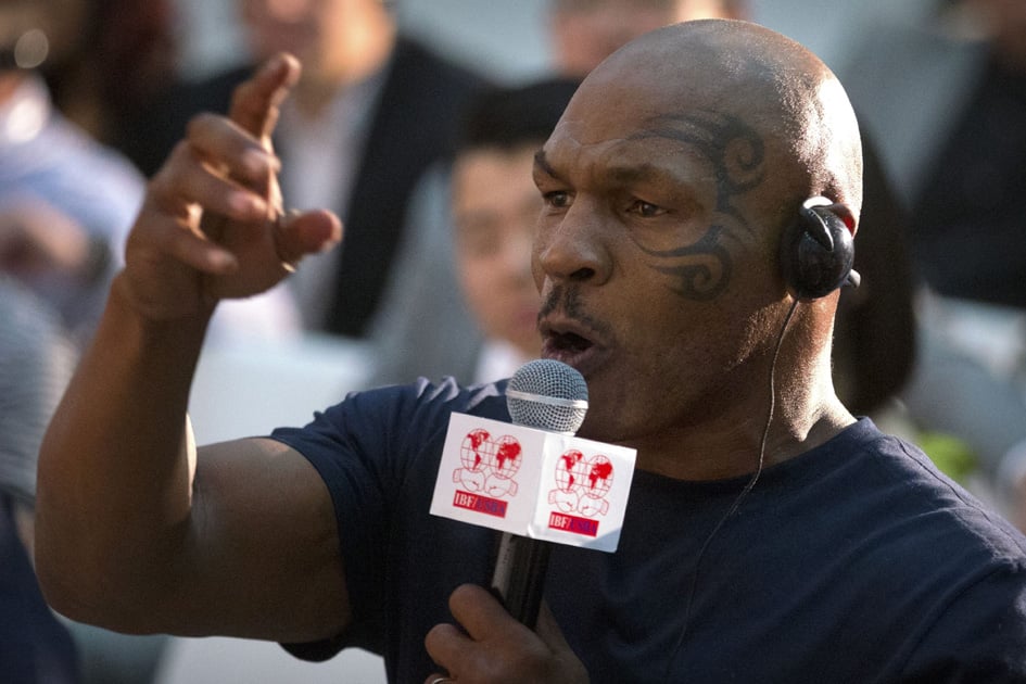 Former heavyweight boxing champion Mike Tyson speaks during a panel discussion held before the 2016 IBF World Championship Bout at the National Tennis Center in Beijing.