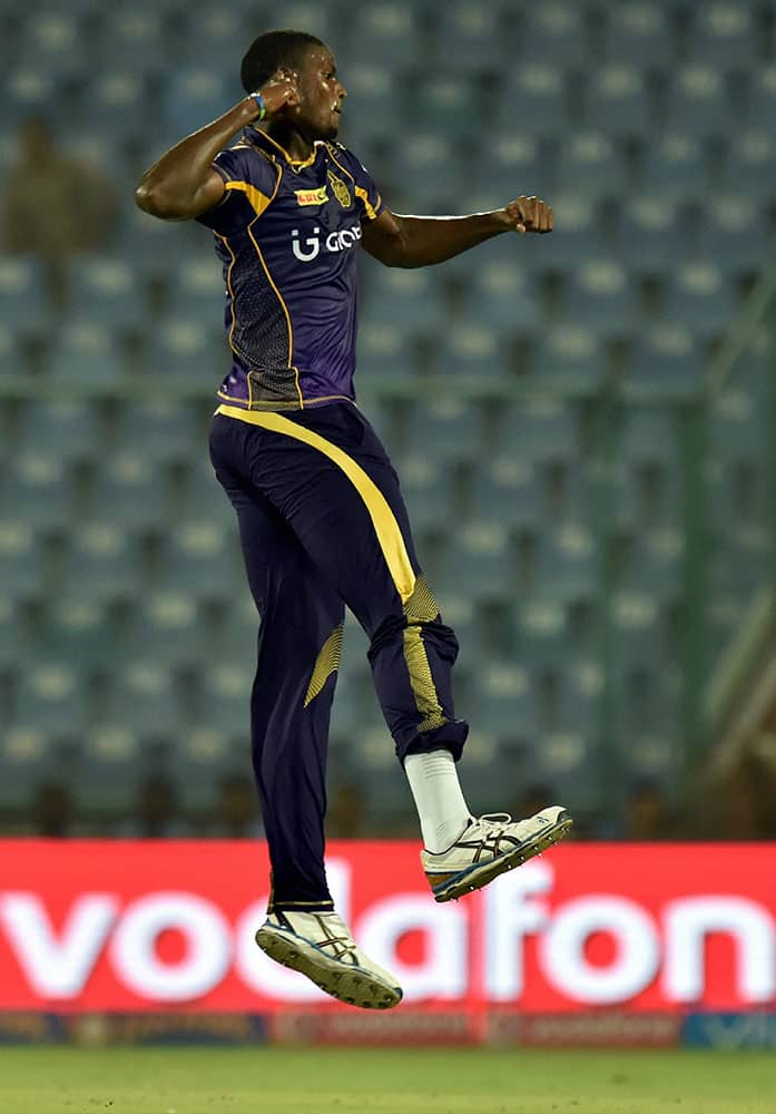 KKRs bowler Jason Holder celebrates the wicket of Sunrisers Hyderabad batsman Naman Ojha during the IPLT20 eliminator match at Feroz Shah Kotla in New Delhi.