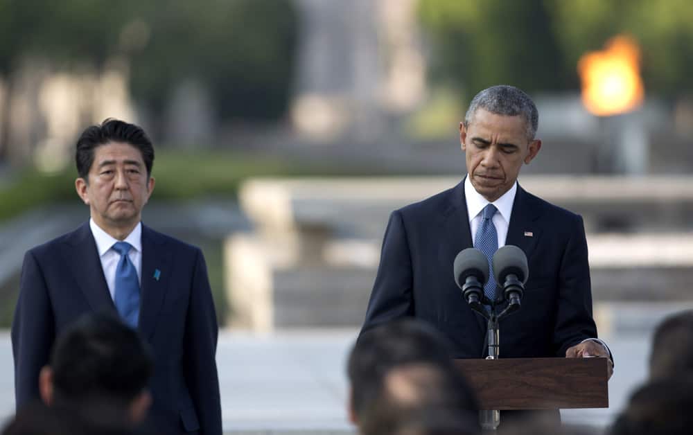 U.S. President Barack Obama, right, accompanied by Japanese Prime Minister Shinzo Abe, gives a speech at Hiroshima Peace Memorial Park in Hiroshima, western Japan.