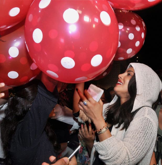 Bollywood actor Priyanka Chopra with her fans as she returns back from USA, in Mumbai.