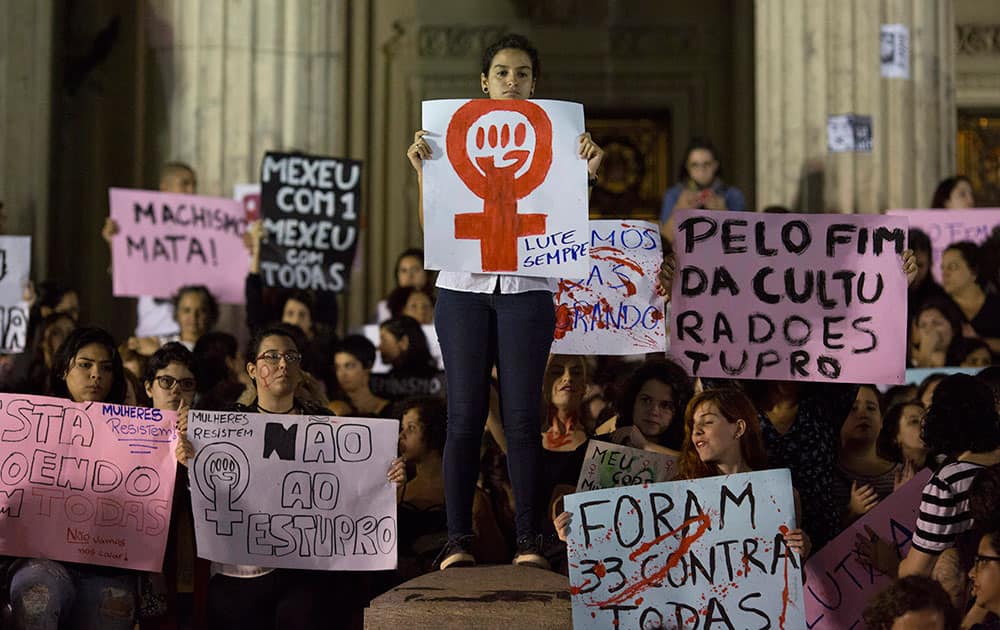 Demonstrators protest the gang rape of a 16-year-old girl in Rio de Janeiro, Brazil.