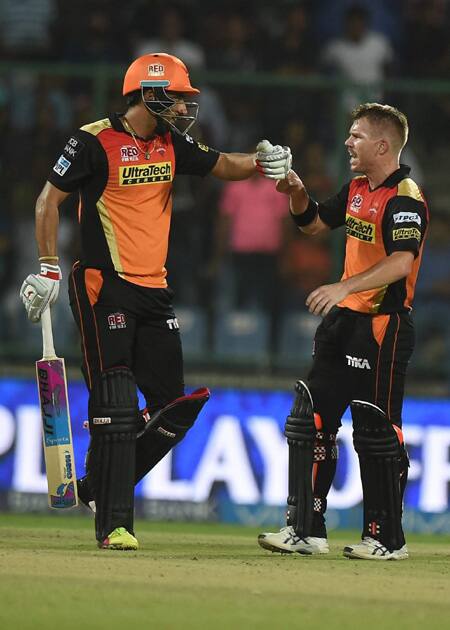 Sunrisers Hyderabad batsman David Warner with teammates Bipul Sharma celebrate after winning during an IPL T20 match against Gujarat Lions at Feroz Shah Kotla.