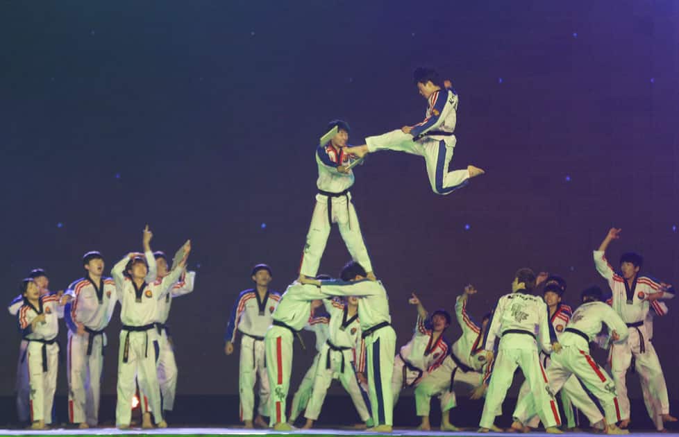 South Korean members of a Taekwondo demonstration team perform during the opening ceremony of Rotary International Convention in Goyang, South Korea.