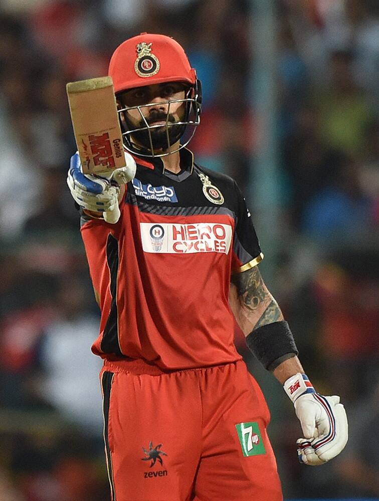 Royal Challengers Bangalores Skipper Virat Kohli celebrates his fifty runs during the IPL 2016 final match between Royal Challengers Bangalore and Sunrisers Hyderabad at Chinnaswamy Stadium in Bengaluru.