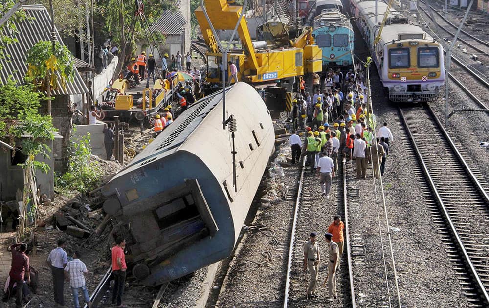 Restoration work in progress after an empty coach derailed off a slow track between Lower Parel and Elphinstone railway station in Mumbai.