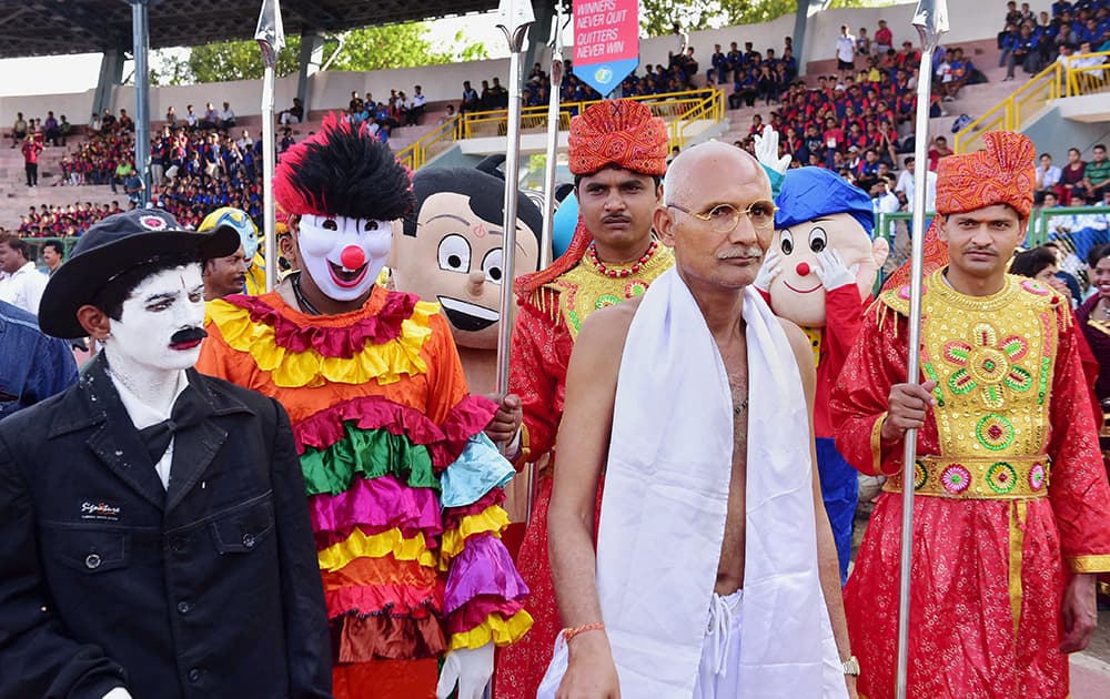 A man dressed as Gandhi accompanies a large number of youths in a Carnival Rally on the occasion of World No Tobacco Day.