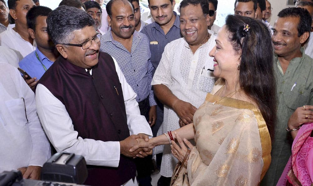 Union Minister for Communication & IT, Ravi Shankar Prasad with BJP MP Hema Malini during Vikas Parv function.