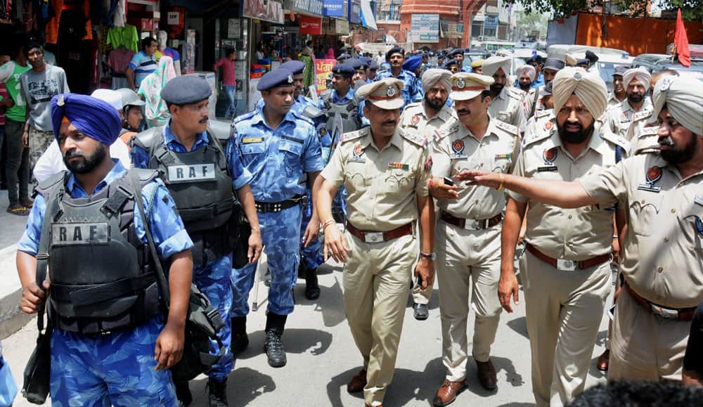 Rapid Action Force (RAF) personnel take out flag march to instill a sense of security and safety among the residents of Amritsar ahead of the Operation Blue Star anniversary, in Amritsar.