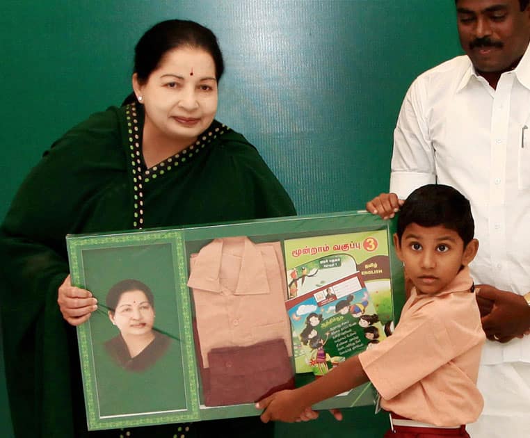 Tamil Nadu Chief Minister Jayalalithaa distributes free textbooks and uniforms to the students of government schools in Chennai.