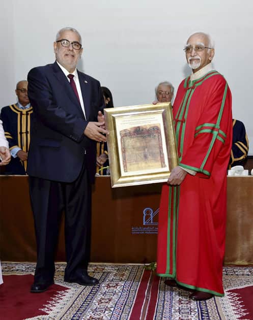 Vice President M. Hamid Ansari being conferred an honoris causa degree of Mohammed V University by Prime Minister of Morocco, Abdelilah Benkirane at a function in Rabat, Morocco.