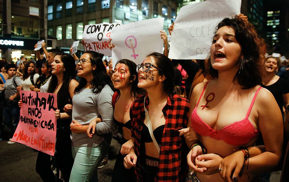 Women march during a protest against the gang rape of a 16-year-old girl in Sao Paulo, Brazil.