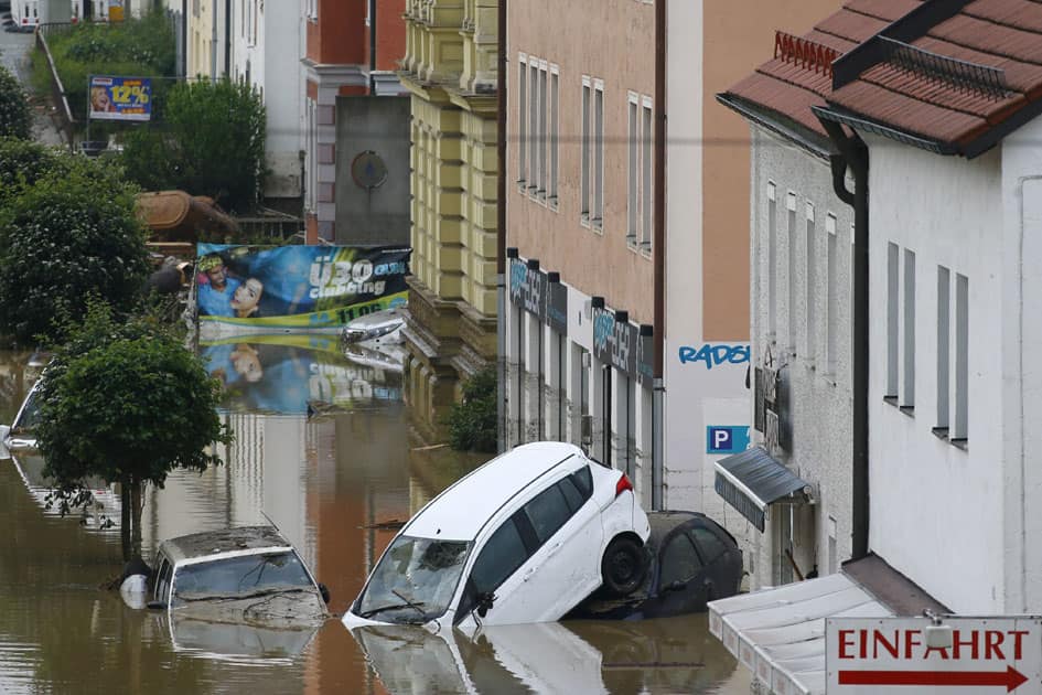 Cars float in the street in the flood waters in Simbach am Inn, Germany.