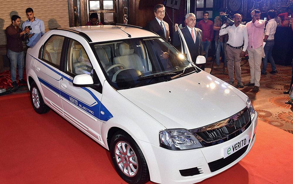 President and Chief Executive (Automotive)Mahindra & Mahindra Ltd, Pravin Shah(R) and Arvind Mathew, CEO, Mahindra Reva Electric Vechicles Ltd, during the launch of Mahindras all electric e Verito in New Delhi.
