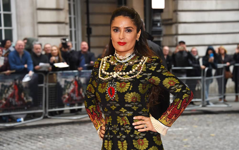 Actress Salma Hayek poses for photographers upon arrival at the premiere of the film 'Tale Of Tales' in London.