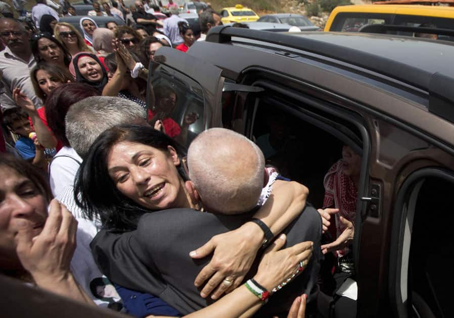 Palestinian lawmaker Khalida Jarrar is greeted by supporters after her release from an Israeli prison at Jabara checkpoint near the West Bank town of Tulkarem.