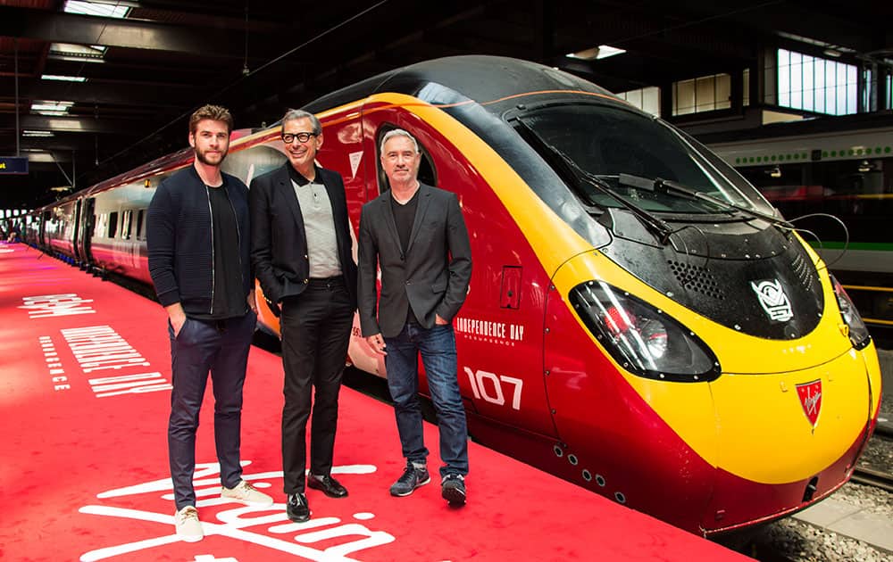 Actors Liam Hemsworth, Goldblum and Director Roland Emmerich at Euston Station in central London Actors Liam Hemsworth, Goldblum and Director Roland Emmerich at Euston Station in central London