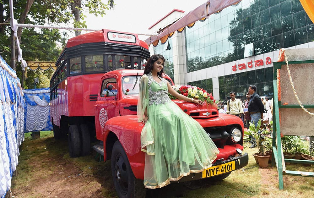 Kannada actress Mayuri poses with an old bus Banshankar