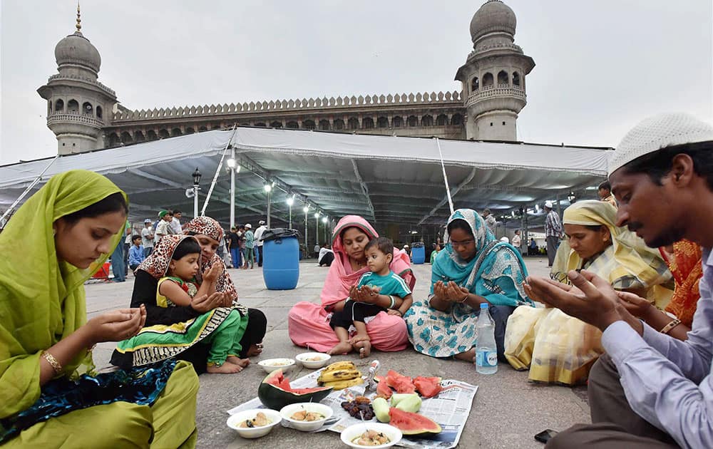 Muslims breaking their fast during Iftar