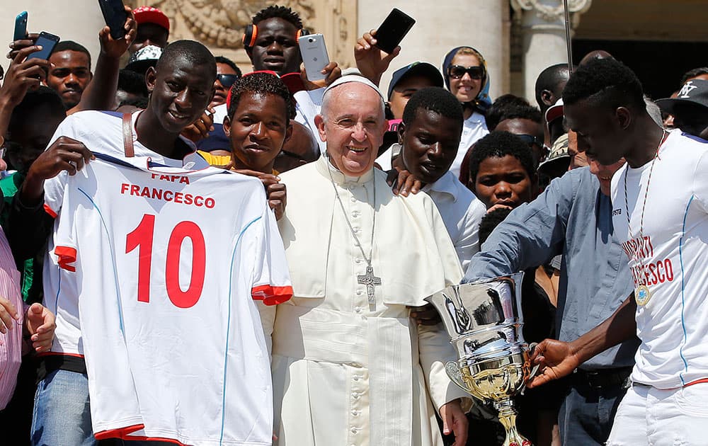 Pope Francis poses for a family picture at the Vatican