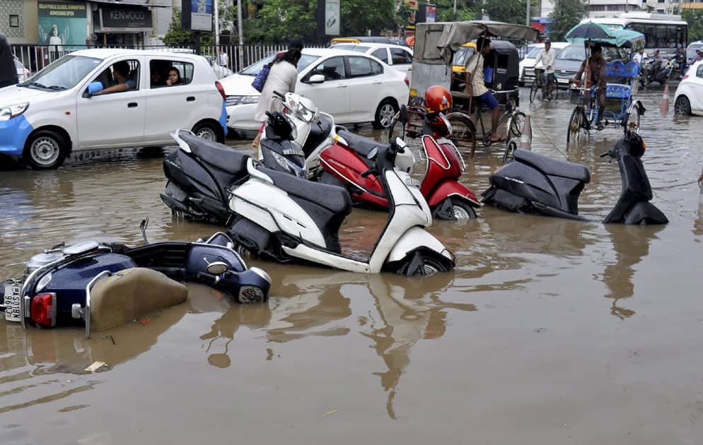 Two-wheelers semi-submerged in a water