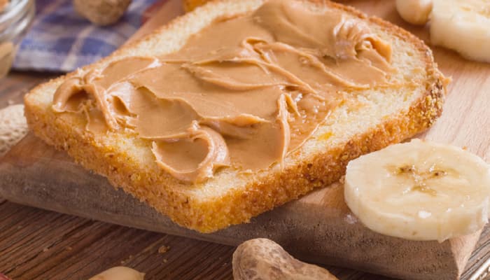 The wealth of health, peanut butter is amazing when it comes to building muscle, burning fat, and even fighting heart disease, but it will only offer you these benefits if eaten in moderation. Two large spoonfuls of peanut butter can pack almost as many calories and fat as a Snickers bar! So there you have it! Use it sparingly.
