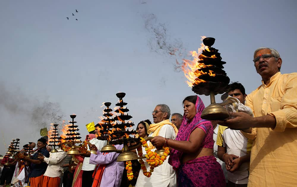 Hindu devotees offer prayers at Sangam