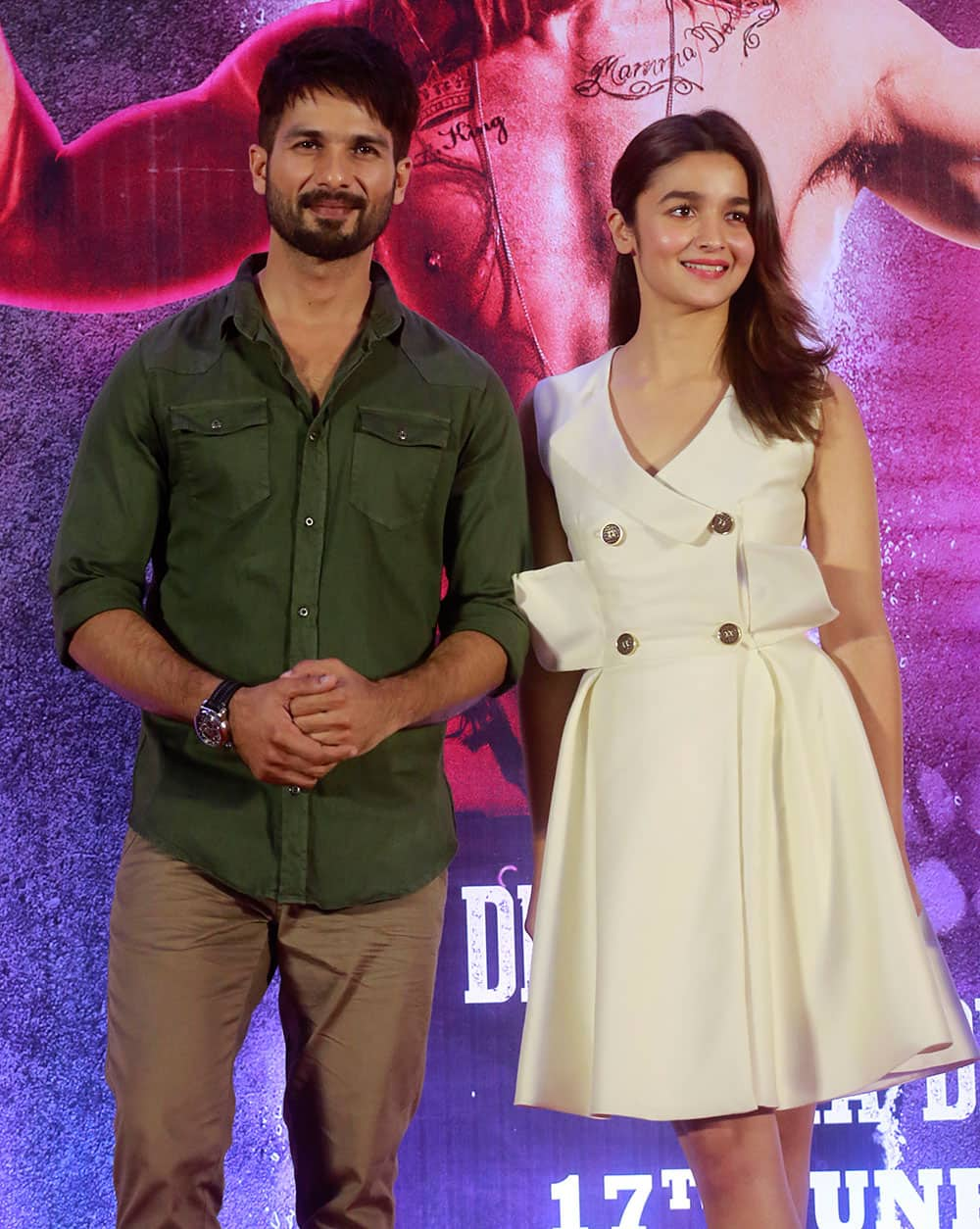 Shahid Kapoor and Alia Bhatt pose for photographs after a press conference of the film in Mumbai