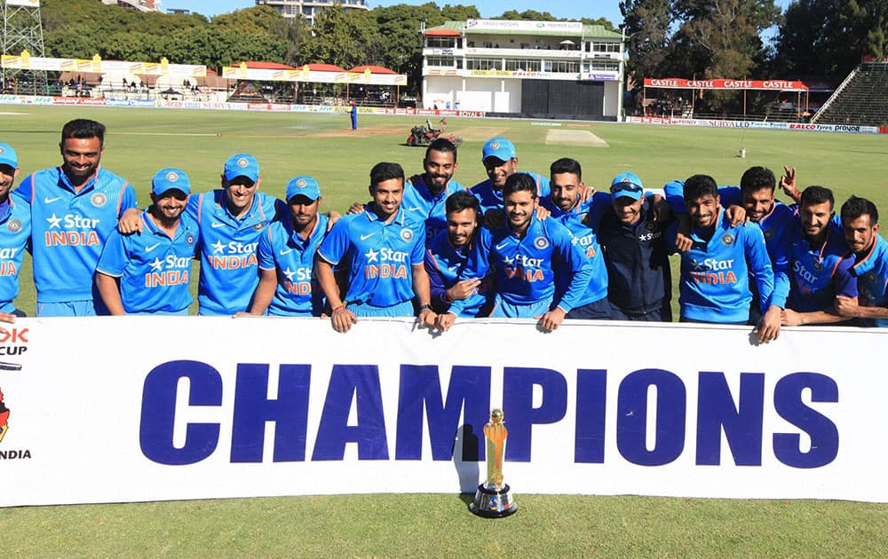 The Indian Cricket team poses for a photo with the trophy after winning the ODIl cricket match against Zimbabwe