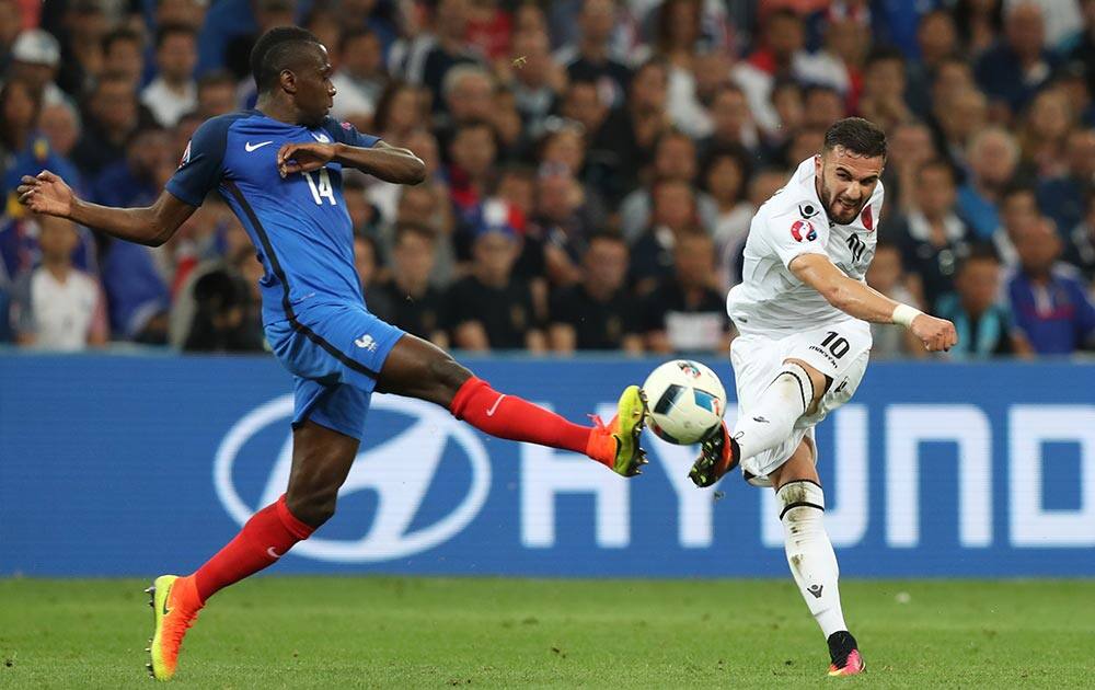 France's Blaise Matuidi, left, goes for the ball against Albania's Armando Sadiku during the Euro 2016