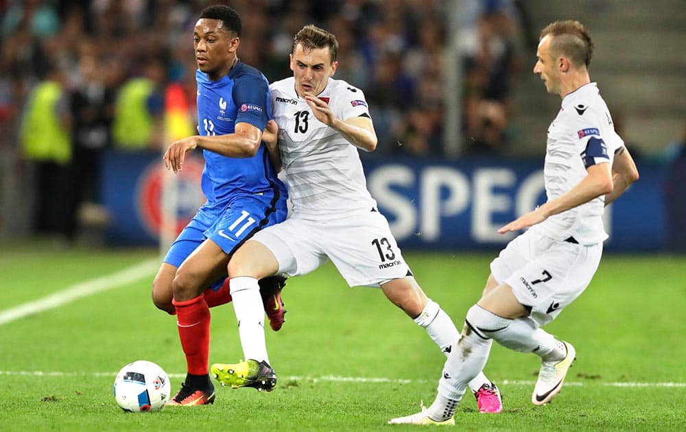 France's Anthony Martial, left, is challenged by Albania's Burim Kukeli