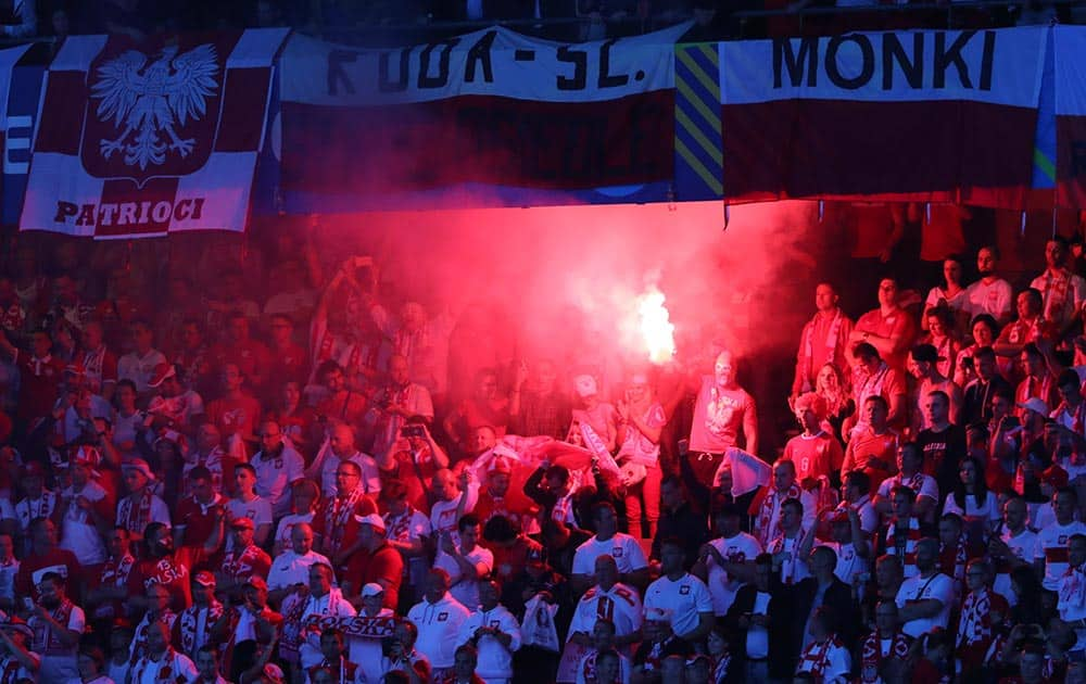 Poland supporters light firework prior to the Euro 2016 Group