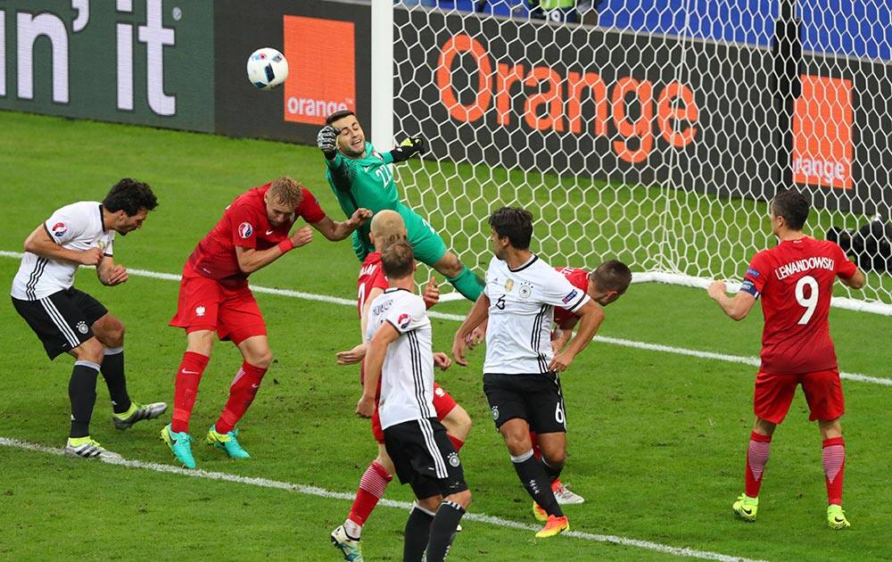 Poland goalkeeper Lukasz Fabianski deflects a ball during the Euro 2016 Group